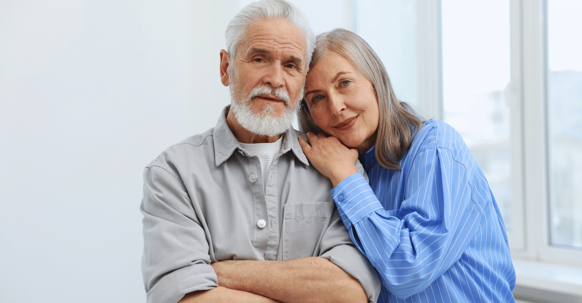 Couple reviewing financial plans and preparing for retirement after children have left home